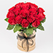 Euroflorist Blumenstrauß 7814 "Luxusrosen in Hutbox". Das Bouquet umfasst 30 rote Luxusrosen in einer eleganten, beigen Hutbox.