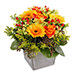 Composition florale jaune et orange Marbella | Envoyer une composition avec des roses, hypericum et germinis livraison à domicile par un fleuriste partout en France